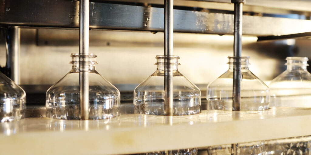 Sunflower oil production plant. Bottling line of vegetable oil in bottles