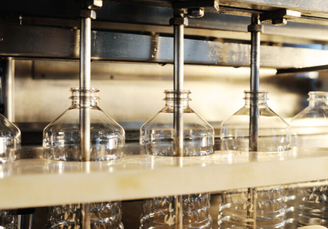 Sunflower oil production plant. Bottling line of vegetable oil in bottles